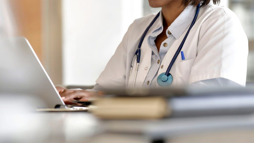 health provider at laptop