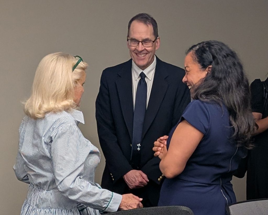 Representatives Dingell and Mejia speaking with Packard Health ED Ray Rion