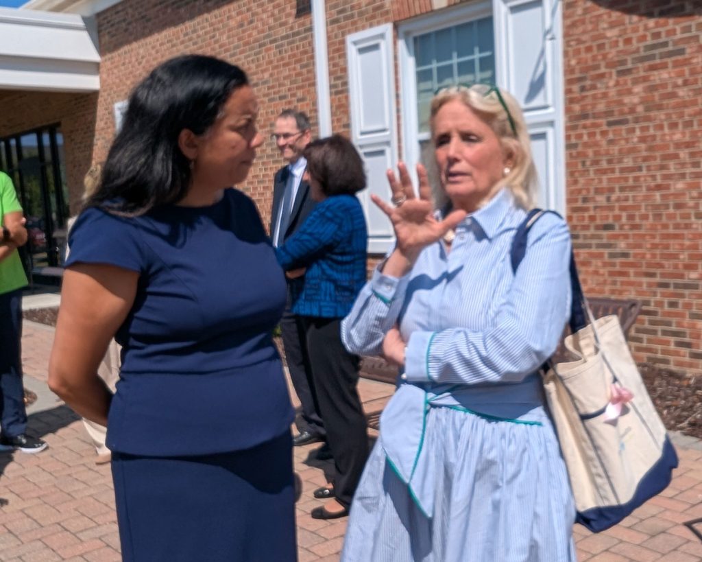 Representatives Dingell and Mejia speaking outside Packard Health