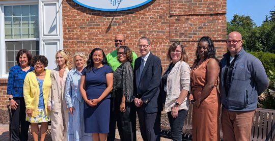 Representatives Dingell and Mejia at a standing outside Packard Health Carpenter clinic with Packard Health staff and board members